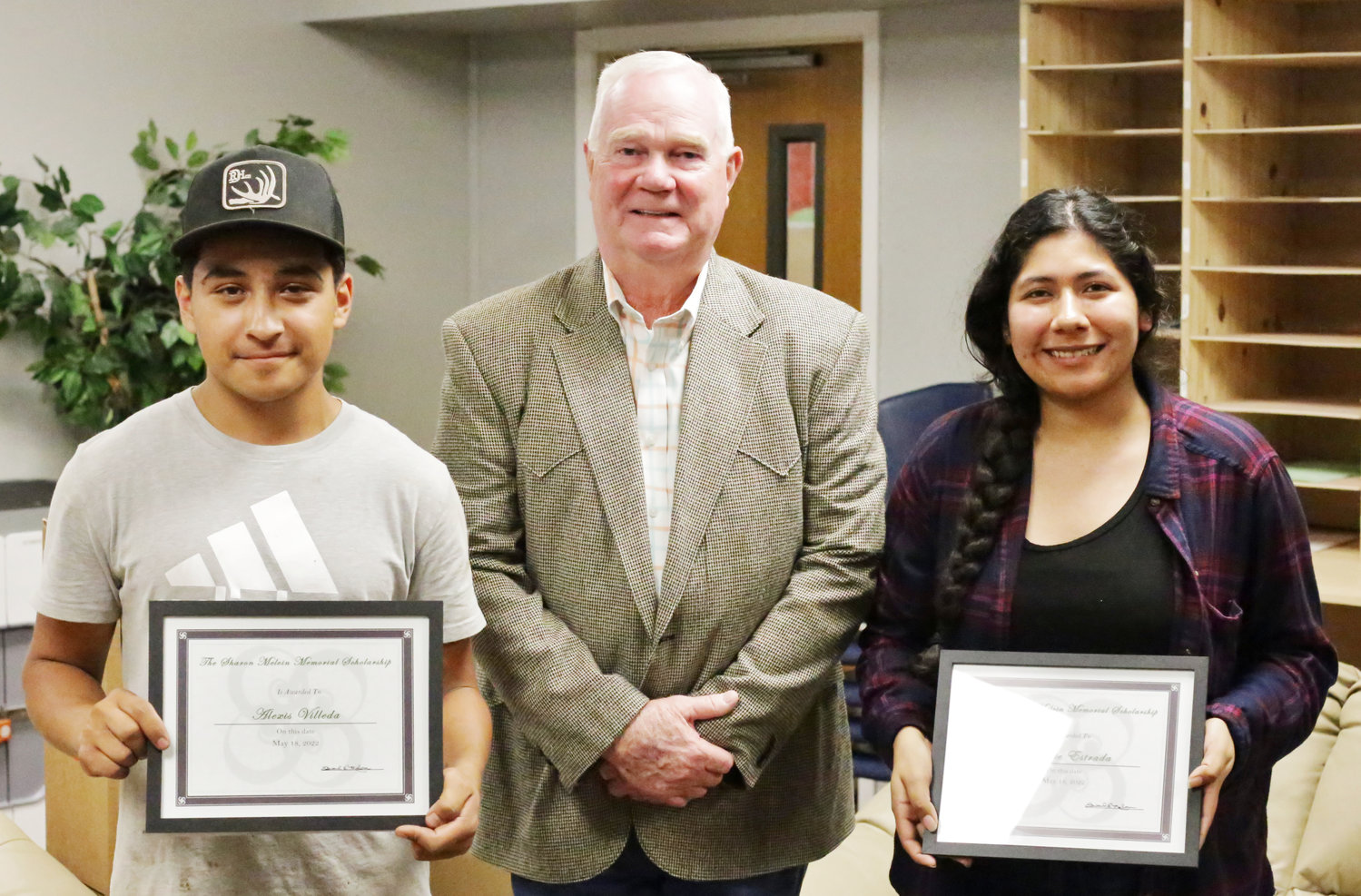 Mineola graduates Maggie Estrada and Alexis Villeda, with Dick Melvin, earned selection as the initial recipients of the Sharon Melvin Memorial Scholarship.